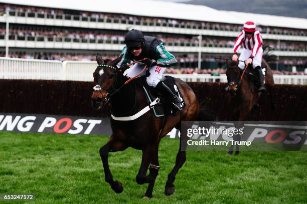 Altior ridden by Nico De Boinville jumps the last before going on to win the Racing Post Arkle Challenge Trophy Novices Chase during Champion Day of...