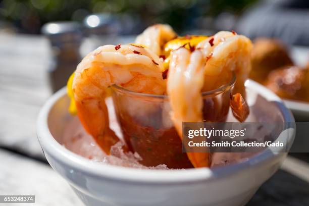 Shrimp cocktail served with lemon and cocktail sauce at a restaurant in Stinson Beach, California, March 12, 2017. .