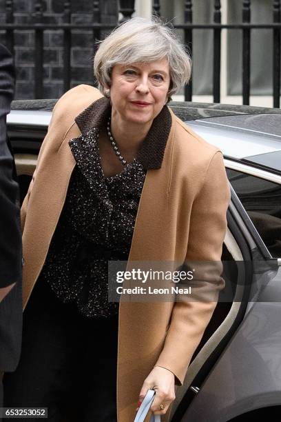 British Prime Minister Theresa May returns to number 10, Downing Street, after delivering a statement on the EU Council meeting, to the House of...