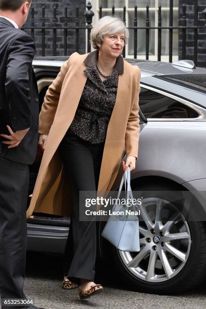 British Prime Minister Theresa May returns to number 10, Downing Street, after delivering a statement on the EU Council meeting, to the House of...