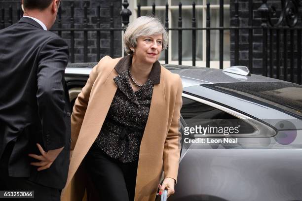 British Prime Minister Theresa May returns to number 10, Downing Street, after delivering a statement on the EU Council meeting, to the House of...