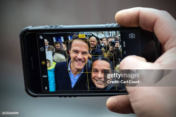 Dutch Prime Minister Mark Rutte takes a selfie photograph with supporters as he campaigns ahead of tomorrow's general election, on March 14, 2017 in...
