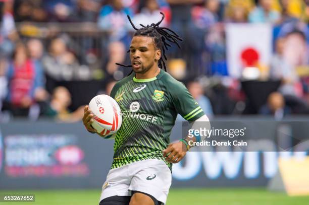 Rosko Specman of South Africa runs for a try against USA during day 2 of the 2017 Canada Sevens Rugby Tournament on March 12, 2017 in Vancouver,...