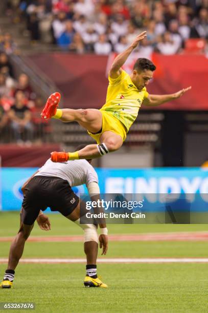 Brandon Quinn of Australia gets sideways in the air after coming in contact with Apisai Domolailai of Fiji during day 2 of the 2017 Canada Sevens...