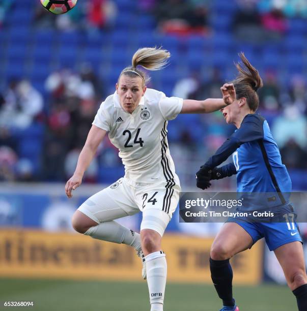 Kristin Demann of Germany challenged by Gaëtane Thiney of France during the France Vs Germany SheBelieves Cup International match at Red Bull Arena...