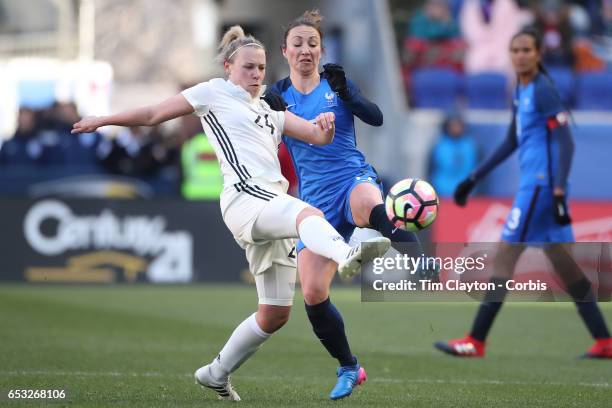 Kristin Demann of Germany challenged by Gaëtane Thiney of France during the France Vs Germany SheBelieves Cup International match at Red Bull Arena...