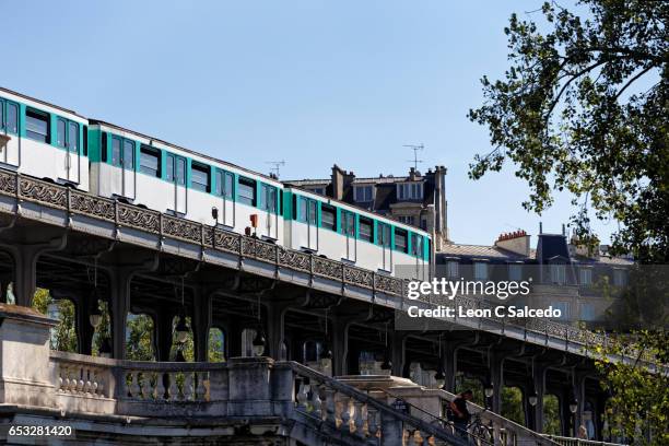 metro train crossing river seine - paris metro stock pictures, royalty-free photos & images