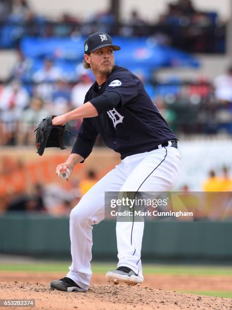 Mark Lowe of the Detroit Tigers pitches during the Spring Training game against the New York Mets at Publix Field at Joker Marchant Stadium on March...