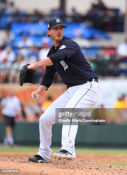 Mark Lowe of the Detroit Tigers pitches during the Spring Training game against the New York Mets at Publix Field at Joker Marchant Stadium on March...