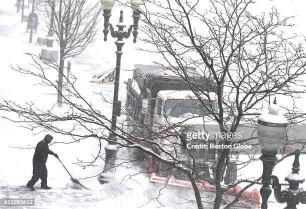 Snow plow passes along Main Street in white-out conditions during a winter storm in downtown Worcester, MA on Mar. 14, 2017.