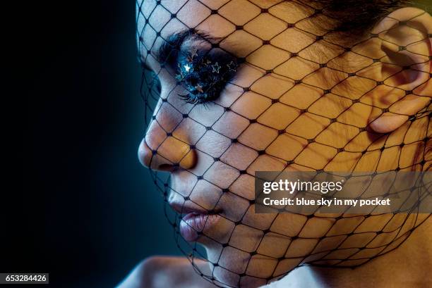 a beautiful young woman wearing a veil. - black eyeshadow stock pictures, royalty-free photos & images