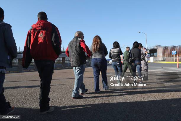 Immigrants are deported across an international bridge into Mexico on March 14, 2017 from Hidalgo, Texas. The Trump administration has ordered an...