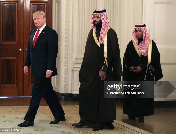 President Donald Trump walks into the State Dinning Room to have lunch with Mohammed bin Salman , Deputy Crown Prince and Minister of Defense of the...