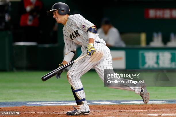 Seiji Kobayashi of Team Japan hits an RBI single in the sixth inning during Game 4 of Pool E of the 2017 World Baseball Classic against Team Cuba at...