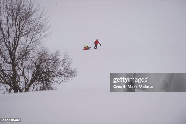 March 14: A father pulls his children in a sled through Valley Forge National Historical Park March 14, 2017 in Valley Forge, Pennsylvania. A...