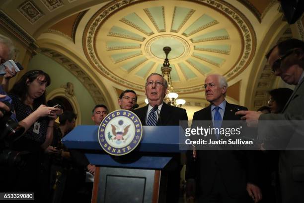 Senate Majority Leader Mitch McConnell speaks as Sen. John Barrasso and Sen. John Cornyn look on during a news conference on Capitol Hill on March...