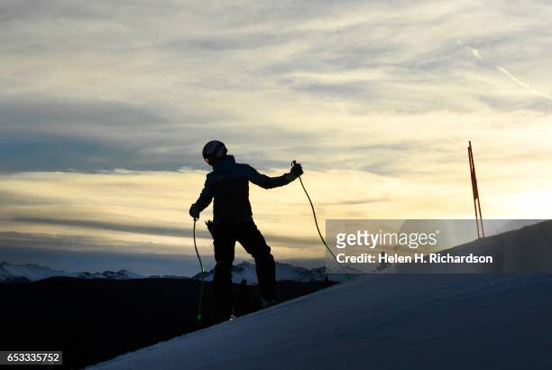 Racer checks out the conditions of the snow and the lines of the downhill course during pre-inspection of the downhill course on Aspen Mountain for...