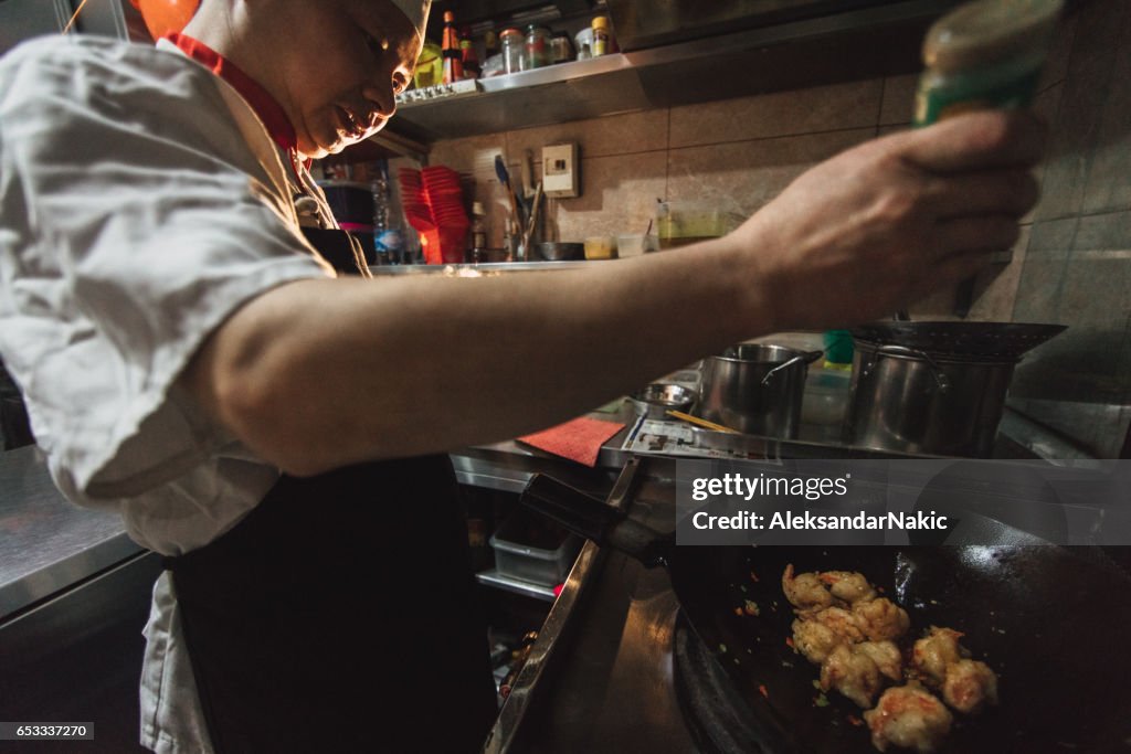 Chef preparing food in Chinese restaurant