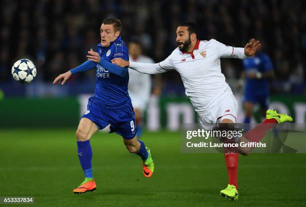 Jamie Vardy of Leicester City is challenged by Adil Rami of Sevilla during the UEFA Champions League Round of 16, second leg match between Leicester...