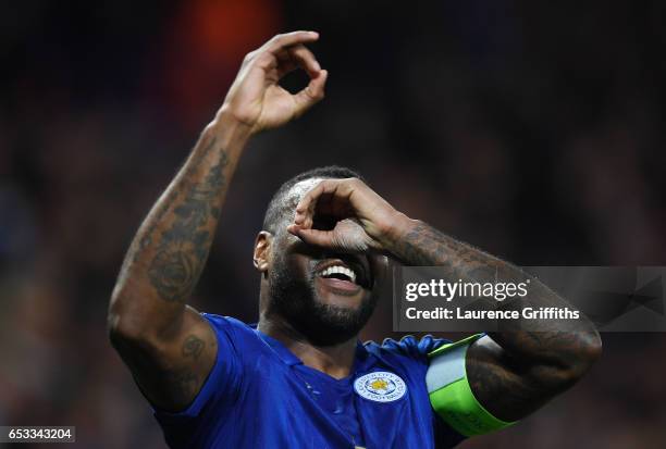 Wes Morgan of Leicester City celebrates after scoring the opening goal during the UEFA Champions League Round of 16, second leg match between...