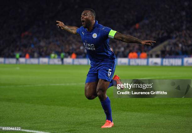 Wes Morgan of Leicester City celebrates after scoring the opening goal during the UEFA Champions League Round of 16, second leg match between...