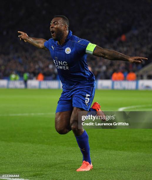 Wes Morgan of Leicester City celebrates after scoring the opening goal during the UEFA Champions League Round of 16, second leg match between...
