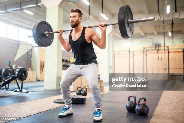 workout in the gym - weight training stock pictures, royalty-free photos & images