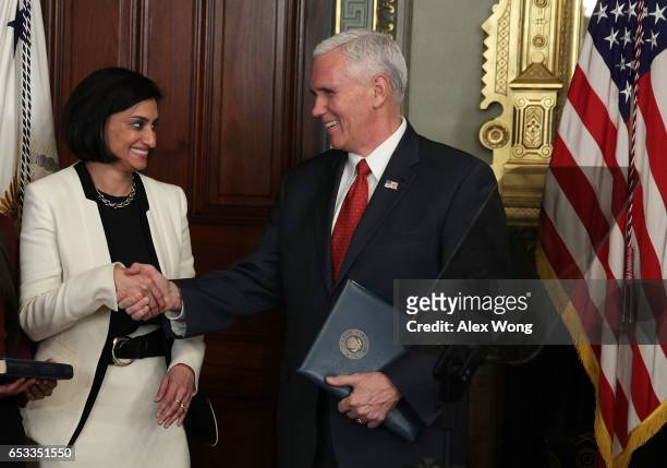 Seema Verma shakes hands with Vice President Mike Pence during a swearing-in ceremony in the Vice President's ceremonial office at Eisenhower...