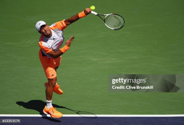 Fernando Verdasco of Spain serves against Rafael Nadal of Spain in their third round match during day nine of the BNP Paribas Open at Indian Wells...