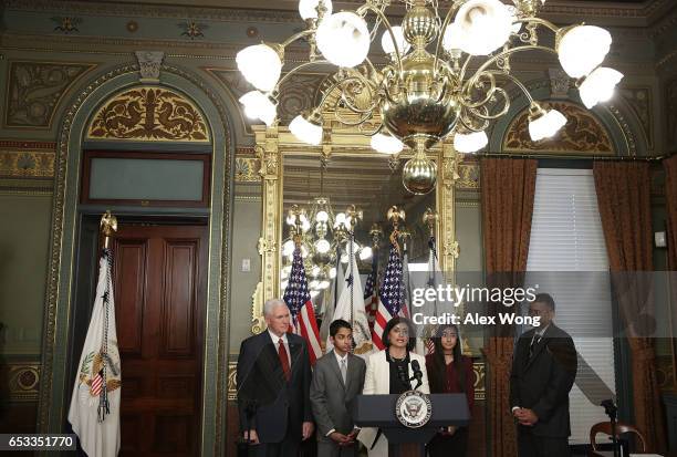 Seema Verma speaks during a swearing-in ceremony, officiated by U.S. Vice President Mike Pence , as her husband Sanjay , daughter Maya and son Shaan...