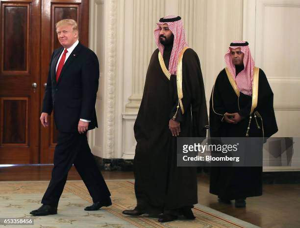 President Donald Trump and Mohammed bin Salman, the Kingdom of Saudi Arabia's deputy crown prince and minister of defense, center, arrive for a lunch...