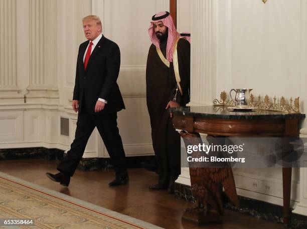 President Donald Trump and Mohammed bin Salman, the Kingdom of Saudi Arabia's deputy crown prince and minister of defense, right, arrive for a lunch...