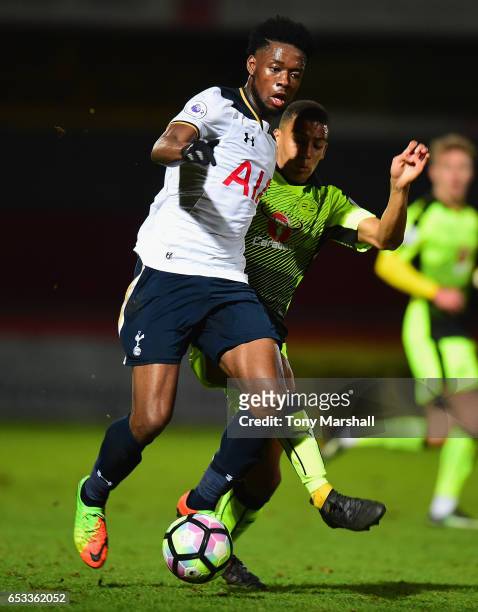 Josh Onomah of Tottenham Hotspur battles for the ball with Andy Rinomhota of Reading during the Premier League 2 match between Tottenham Hotspur and...