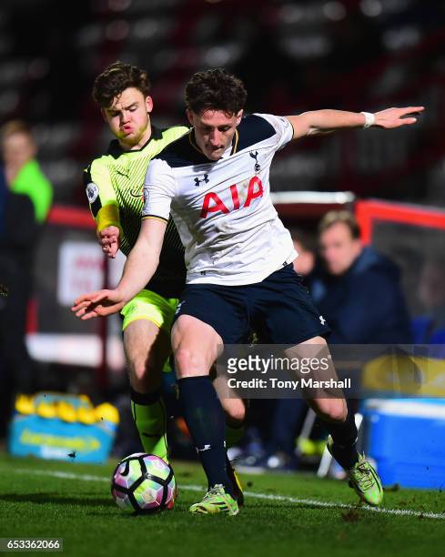 Ryan Loft of Tottenham Hotspur is tackled by Tyler Frost of Reading during the Premier League 2 match between Tottenham Hotspur and Reading at The...