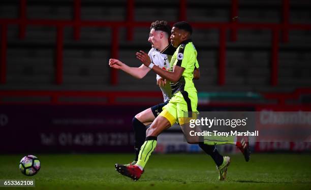 Ryan Loft of Tottenham Hotspur is tackled by Gabriel Osho of Reading during the Premier League 2 match between Tottenham Hotspur and Reading at The...