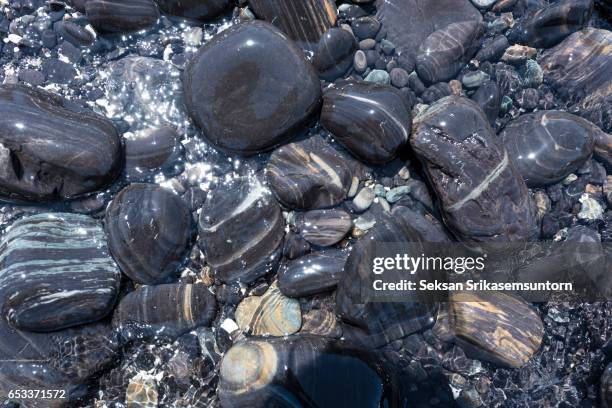 pebble stones on the beach, lipe island, stun, thailand - pebble island stock pictures, royalty-free photos & images