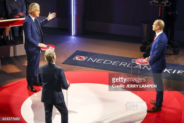 Geert Wilders of the Freedom Party speaks with Gert-Jan Segers of Dutch Christian Union party during a televised debate between the eight top party...