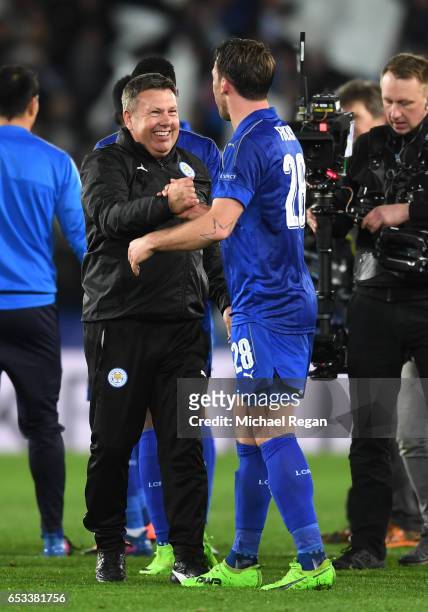 Craig Shakespeare the interim Manager of Leicester City and Christian Fuchs of Leicester City celebrate their team's 3-2 agg victory following the...