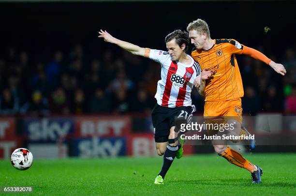 Lasse Vibe of Brentford FC and George Saville of Wolves during the Sky Bet Championship match between Brentford and Wolverhampton Wanderers at...