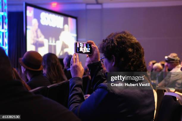 An audience member takes a picture at 'A Conversation With Frank Oz and Leonard Maltin' during 2017 SXSW Conference and Festivals at Austin...