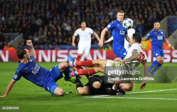 Kasper Schmeichel of Leicester City concedes a penalty as he brings down Vitolo of Sevilla during the UEFA Champions League Round of 16, second leg...