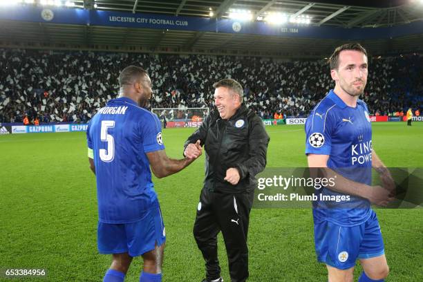 Manager Craig Shakespeare of Leicester City celebrates with Wes Morgan of Leicester City after the UEFA Champions League Round of 16 match between...