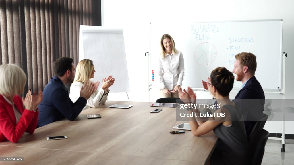 Young businesswoman holding presentation