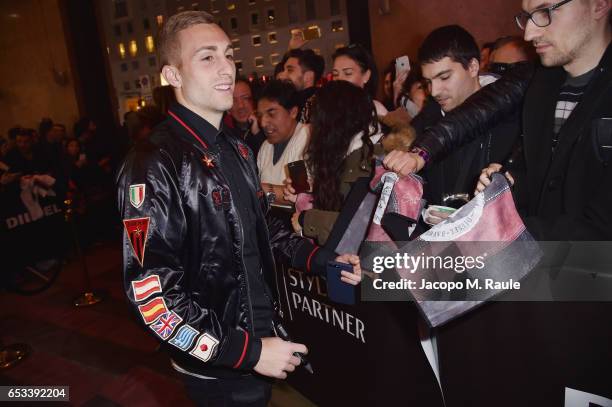 Gerard Deulofe signs autographs during The New Bomber Presentation at the Diesel Store on March 14, 2017 in Milan, Italy.