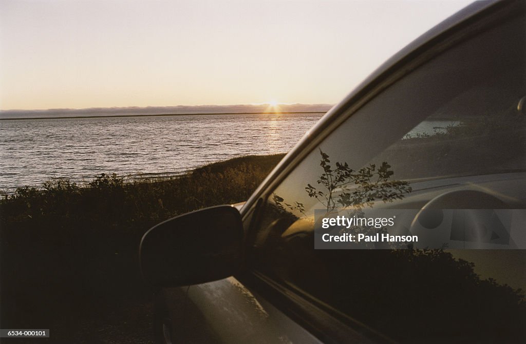 Car by Sea at Sunset