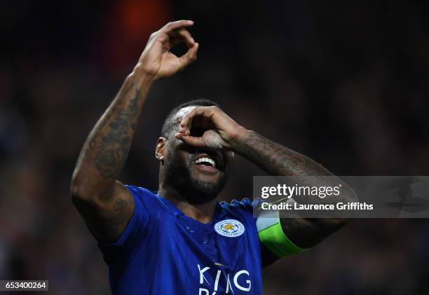 Wes Morgan of Leicester City celebrates scoring the opening goal during the UEFA Champions League Round of 16 second leg match between Leicester City...