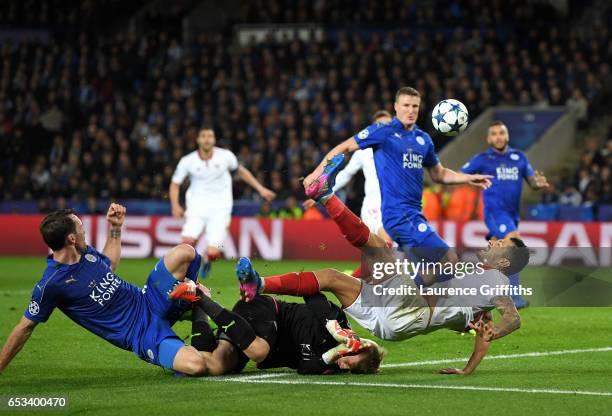 Kasper Schmeichel of Leicester City concedes a penalty as he brings down Vitolo of Sevilla during the UEFA Champions League Round of 16 second leg...