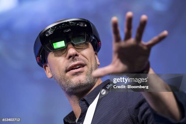 Facundo Diaz, co-founder and chief executive officer of Vrtify Inc., wears a pair of Microsoft Corp, HoloLens glasses as he speaks at the 2017 South...