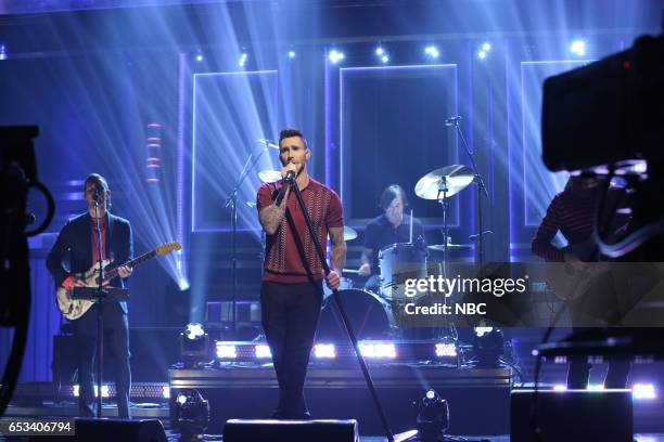 Episode 639 -- Pictured: Jesse Carmichael and Adam Levine of musical guest Maroon 5 perform on March 14, 2017 --