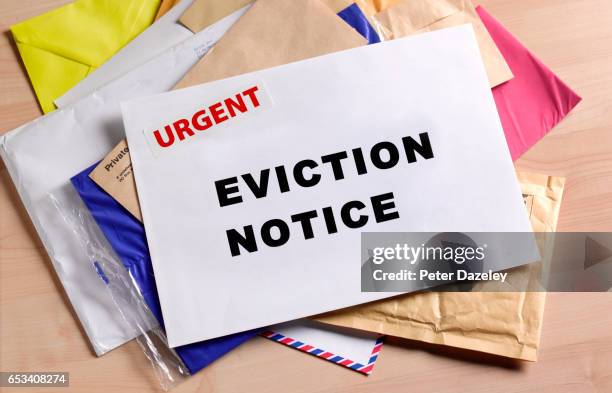 eviction notice on door step - eviction stock pictures, royalty-free photos & images